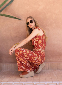 Pantaloni a vita alta terracotta con stampa frecce