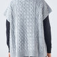 Gilet in maglia a trecce con scollo a V