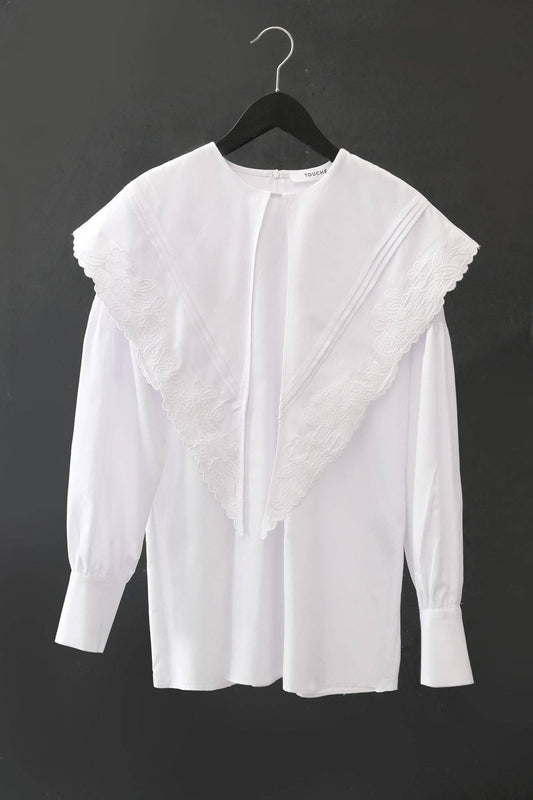 Tunica bianca con maxi colletto ricamato