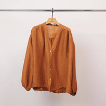 Blusa testurizzata con bottoni e scollo a V