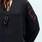 Blusa nera con inserti in pizzo e laccio al collo