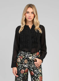 Blusa nera trasparente con volant