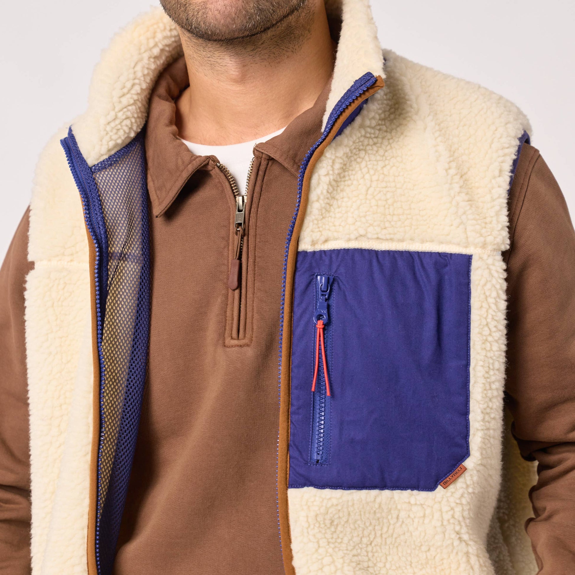 Gilet sherpa unisex con zip avorio e blu