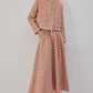 Completo in tweed con giacca corta e gonna lunga