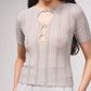 Top in maglia lurex con cut-out frontale