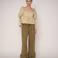 Blusa beige con volant e schiena aperta