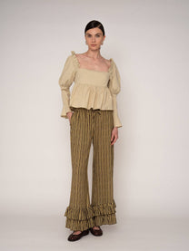 Blusa beige con volant e schiena aperta
