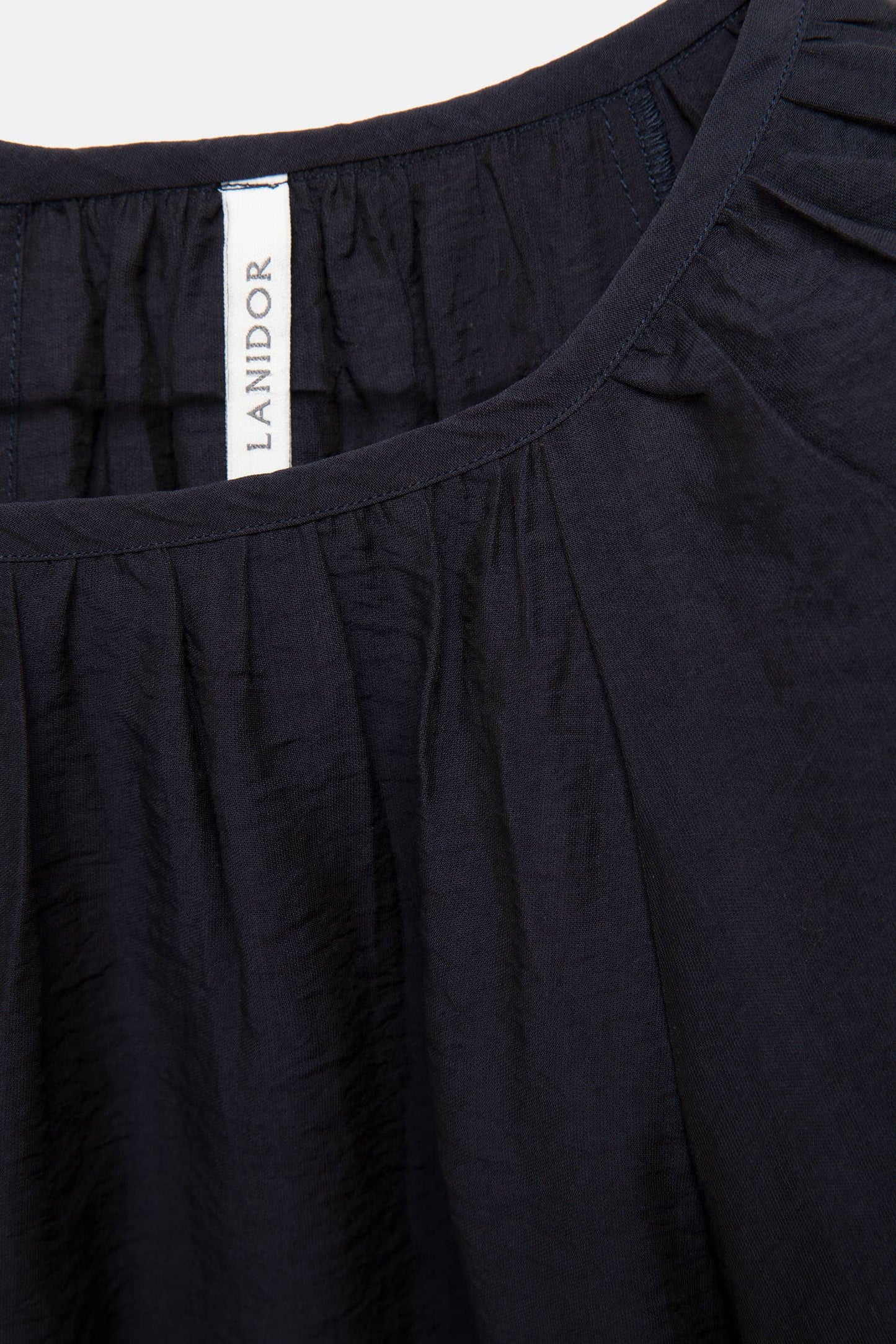 Blusa in tessuto effetto stropicciato con maniche a palloncino
