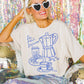 T-shirt oversize grafica “Le Petit Déjeuner” in cotone
