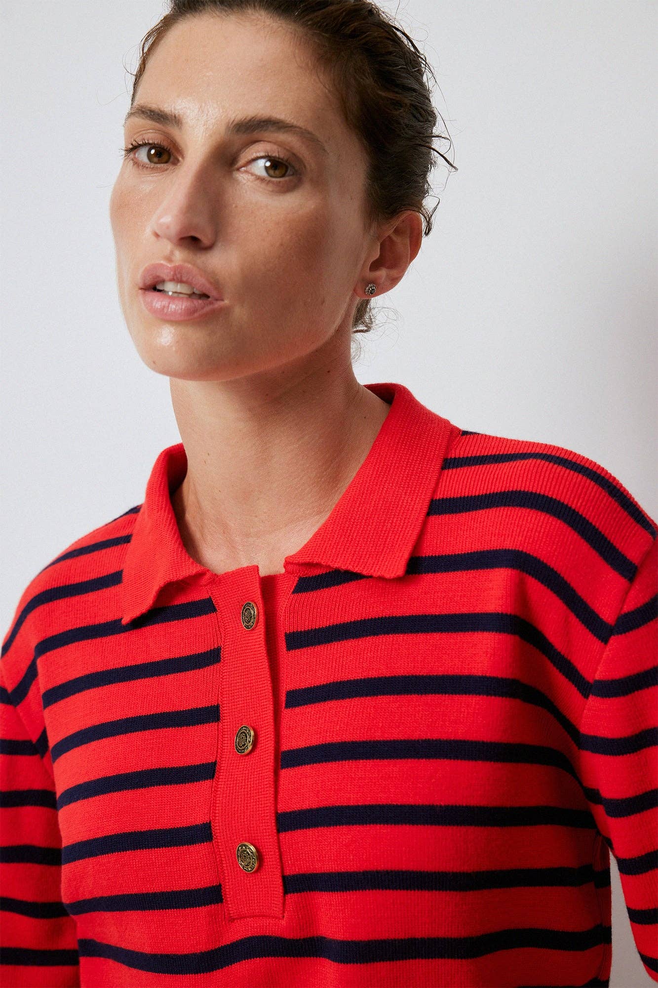 Maglione a righe con collo polo