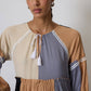 Abito lungo boho patchwork con laccio al collo e nappine