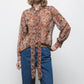 Blusa semitrasparente fantasia con fiocco al collo