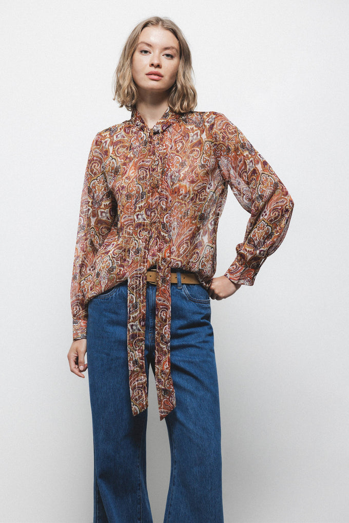 Blusa semitrasparente fantasia con fiocco al collo