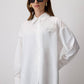 Camicia con spilla floreale in organza