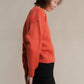 Maglione corto tweed con doppio scollo a V