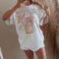 T-shirt oversize grafica “Jesus Loves You A Latte” in cotone