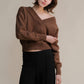 Maglione corto tweed con doppio scollo a V