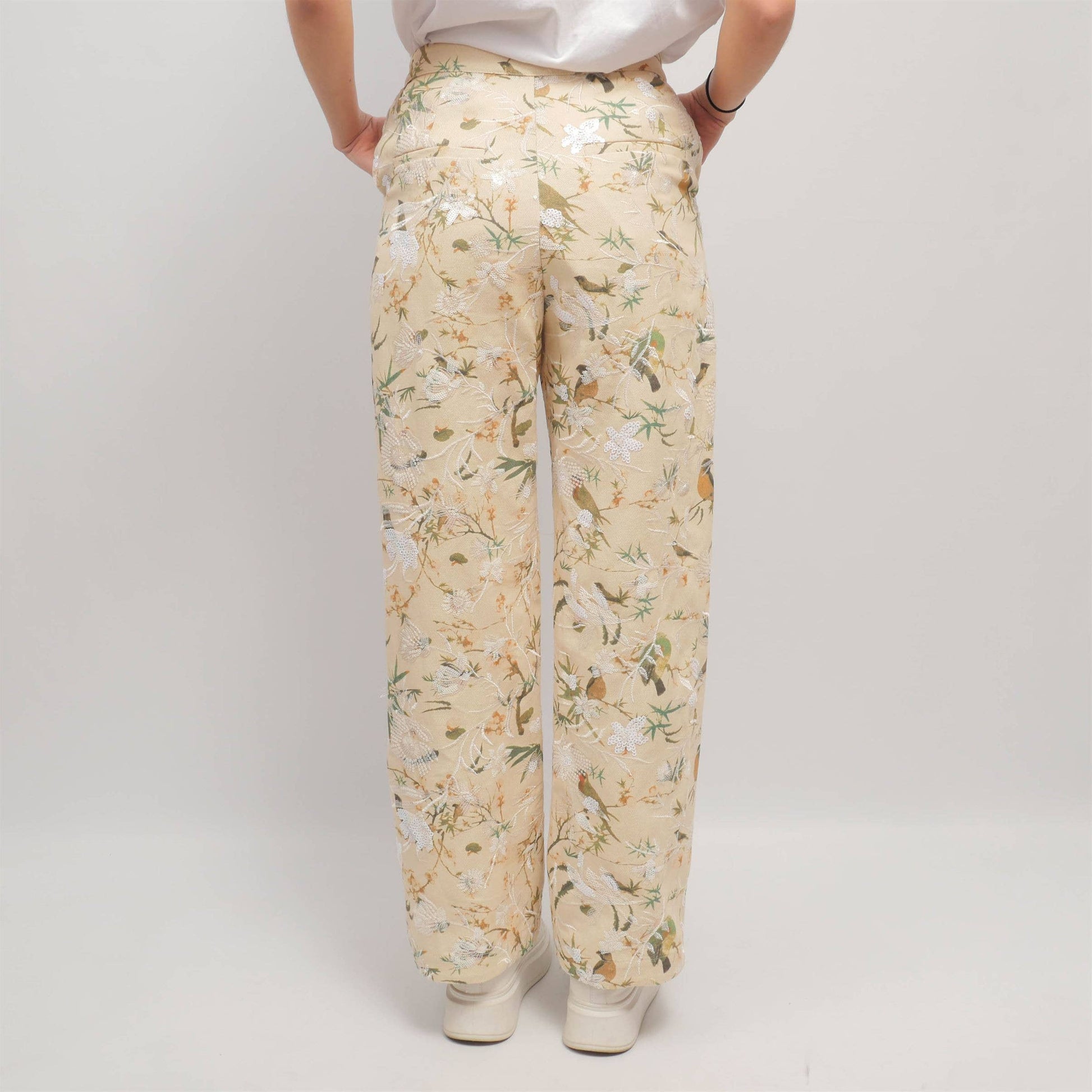 Pantaloni wide leg con ricamo floreale e paillettes