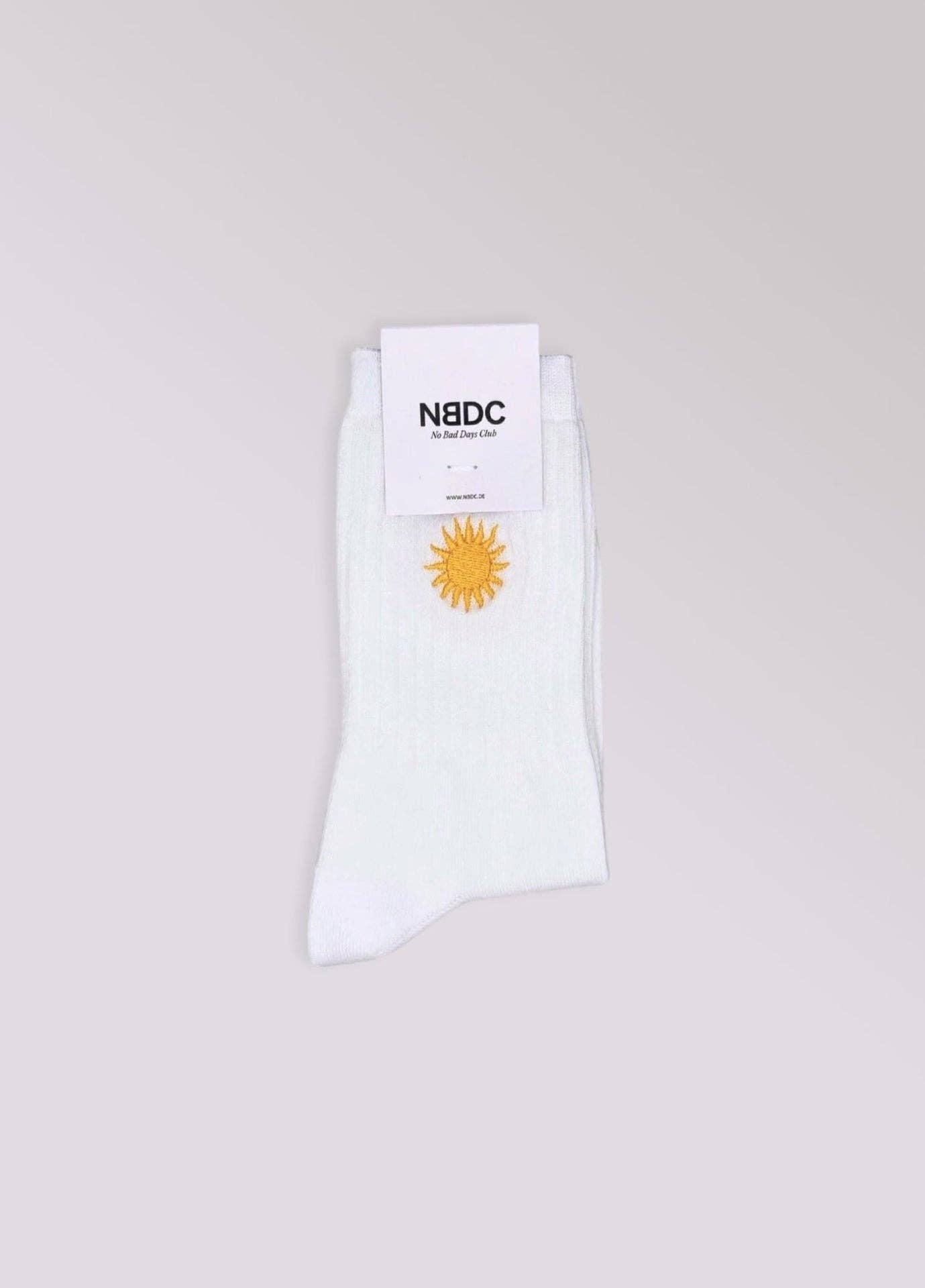Calze bianche con ricamo sole