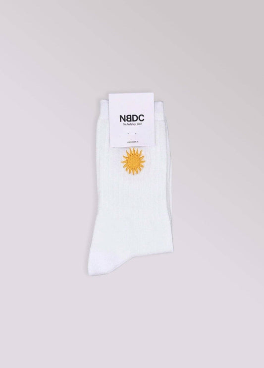 Calze bianche con ricamo sole