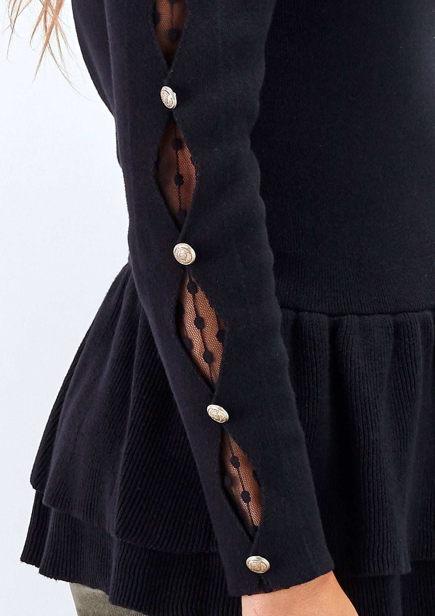 Maglia peplum con inserti in pizzo e bottoni