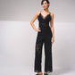 Tuta intera in pizzo con scollo a V e spalline incrociate
