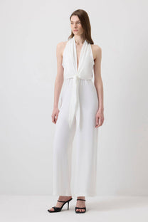 Tuta halter ecrù con fiocco frontale