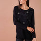 Blusa nera con stelle glitter e scritta