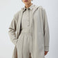 Giacca lunga con cappuccio e zip