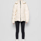 Piumino in eco shearling con cappuccio removibile