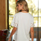 T-shirt in cotone con maniche ricamate