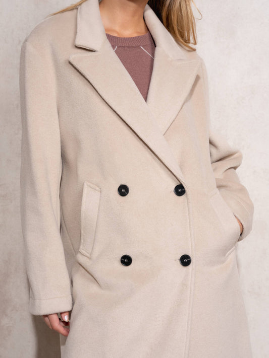Cappotto lungo doppiopetto con revers