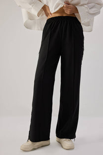 Pantaloni in crêpe con frange
