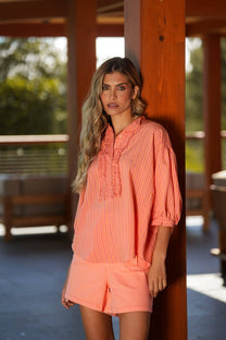 Blusa a righe con volant