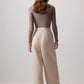 Pantaloni beige a gamba larga con cintura avvolgente