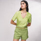Shorts effetto tweed con catena