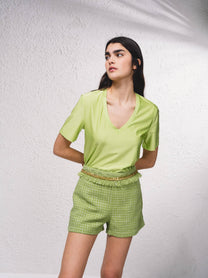 Shorts effetto tweed con catena
