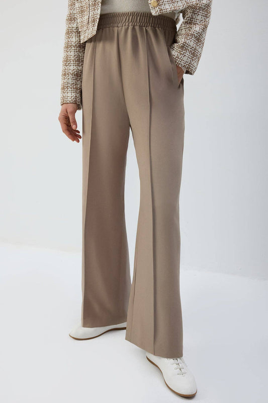 Pantaloni a pieghe con vita elasticizzata