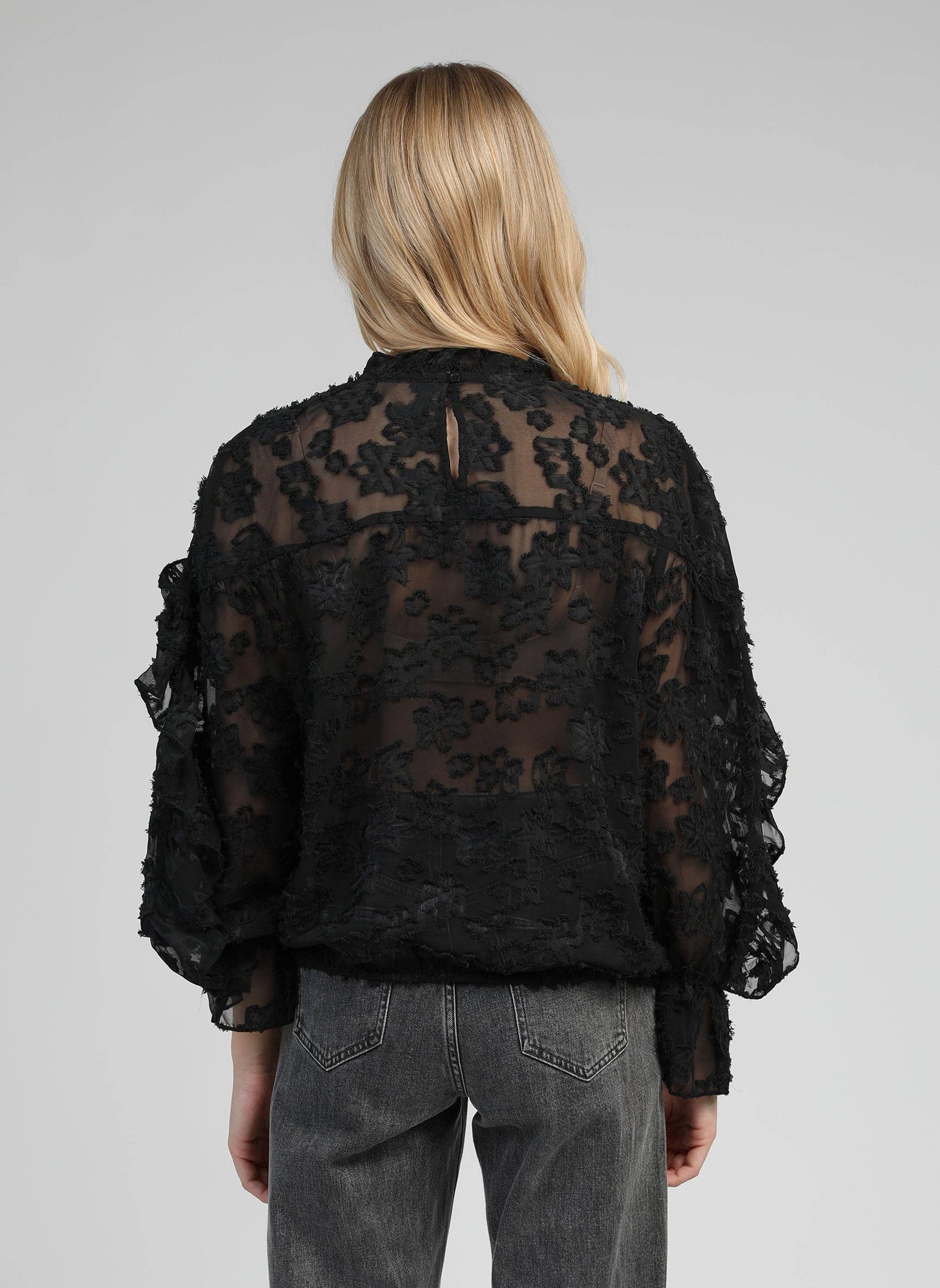 Blusa trasparente jacquard con volant