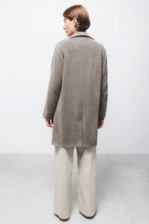 Cappotto lungo fantasia con maniche raglan