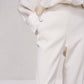 Pantaloni dritti con bottoni decorativi e vita elasticizzata
