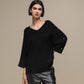 Maglione oversize con scollo a V e bottoni gioiello