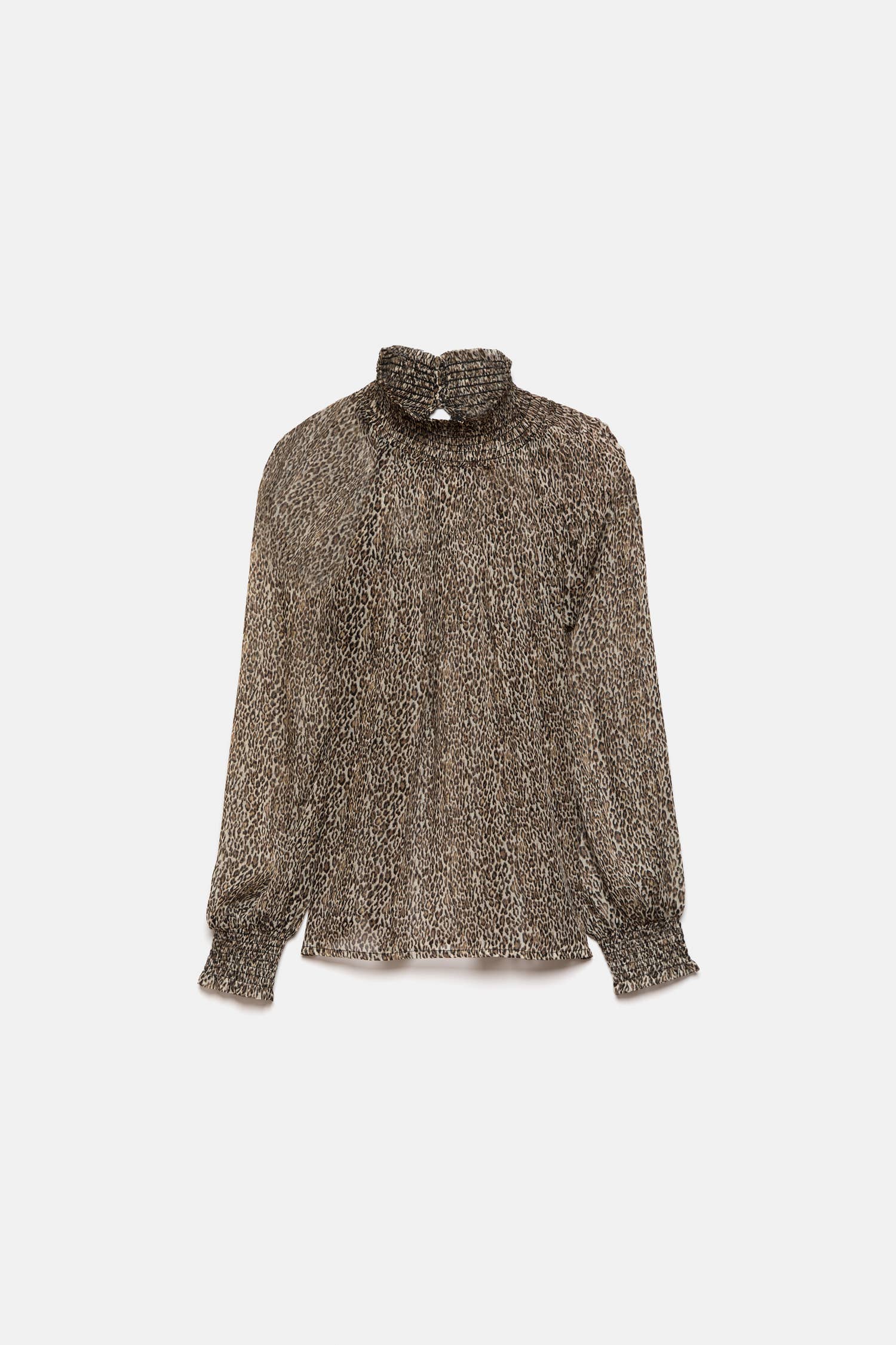 Blusa semitrasparente animalier con collo alto