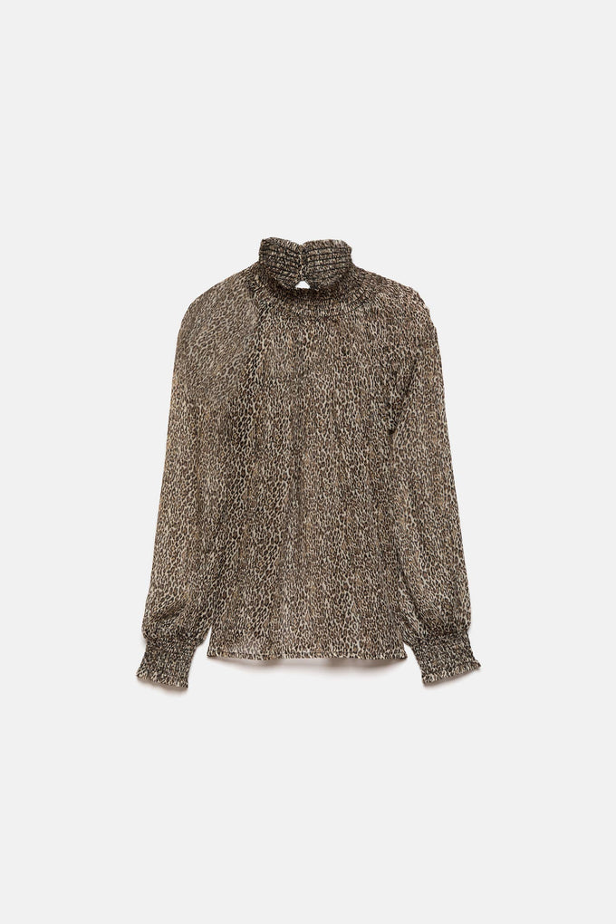 Blusa semitrasparente animalier con collo alto