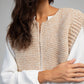 Cardigan smanicato in maglia beige