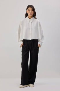 Pantaloni in crêpe con frange