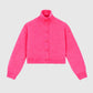 Maglia corta con collo alto e bottoni color candy
