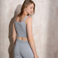 Top cropped in maglia con glitter