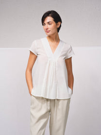 Blusa in cotone con scollo a V e volant