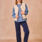 Gilet in ecopelliccia con profili intrecciati blu